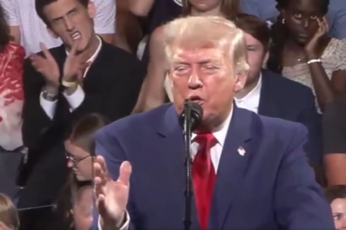 Man Behind Trump at Rally Does Something Unbelievable